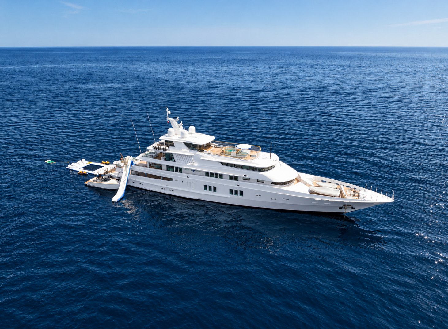 Private superyacht at anchor off Ibiza with water toys